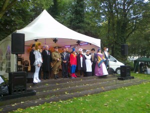 Historical figures in costume around thr Green and High Street